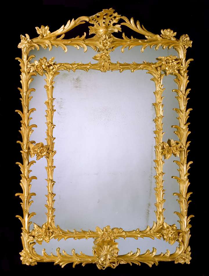 A GEORGE III GILT ‘COMPOSITION’ BORDER GLASS MIRROR